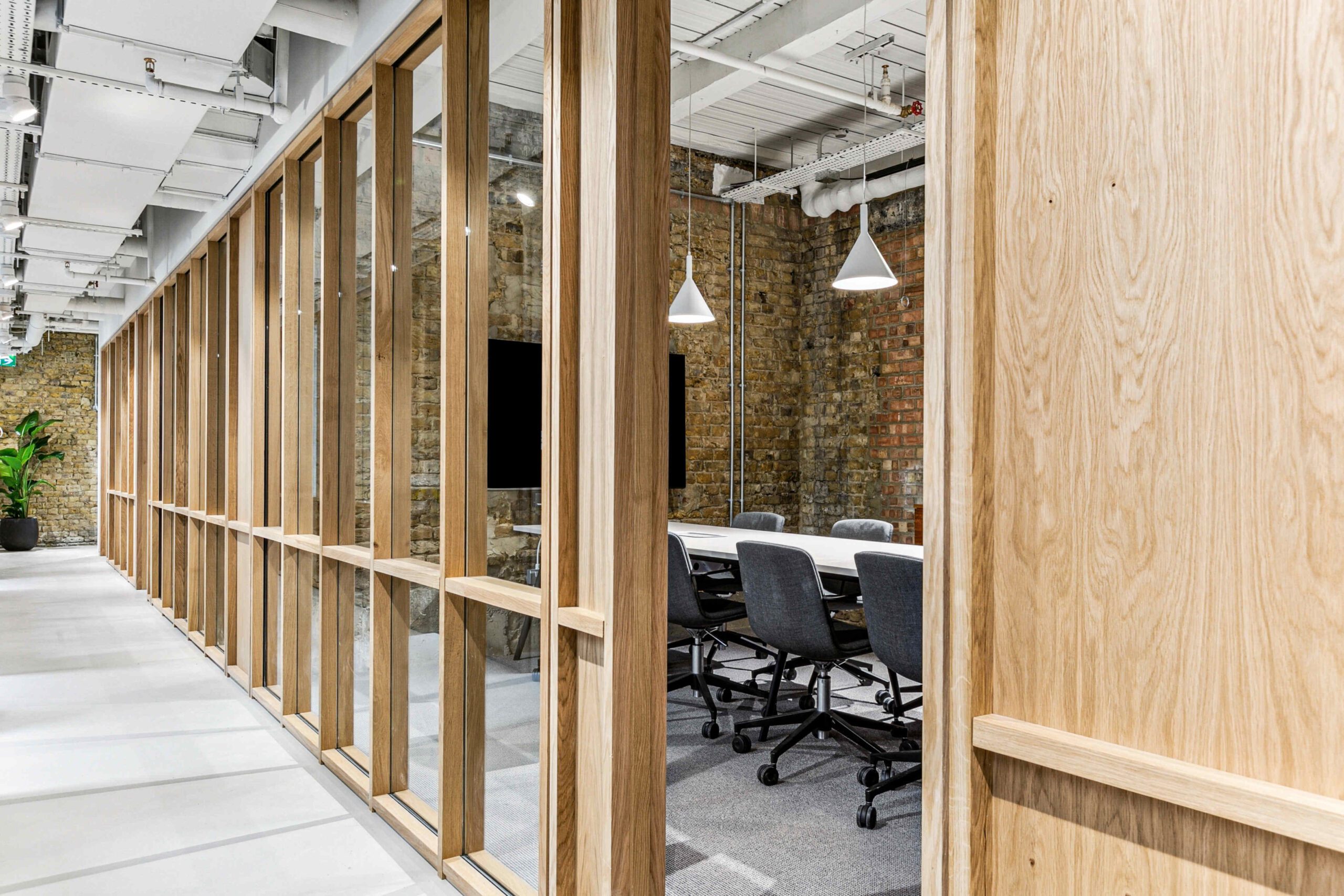 Huddle Wimbledon meeting room showing a wooden paneled corridor